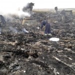 Emergencies Ministry member works at the site of a Malaysia Airlines Boeing 777 plane crash in the settlement of Grabovo in the Donetsk region