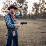 Cowboy with revolver, gunfight on ranch, western