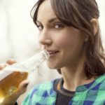 Portrait Of Woman Drinking Beer