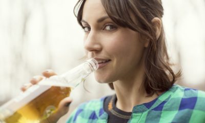 Portrait Of Woman Drinking Beer