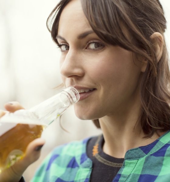 Portrait Of Woman Drinking Beer