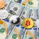 Bitcoin and cryptocurrency on banknotes of one hundred dollars