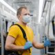 European man wears surgical mask, commutes in metro or underground, carries backpack