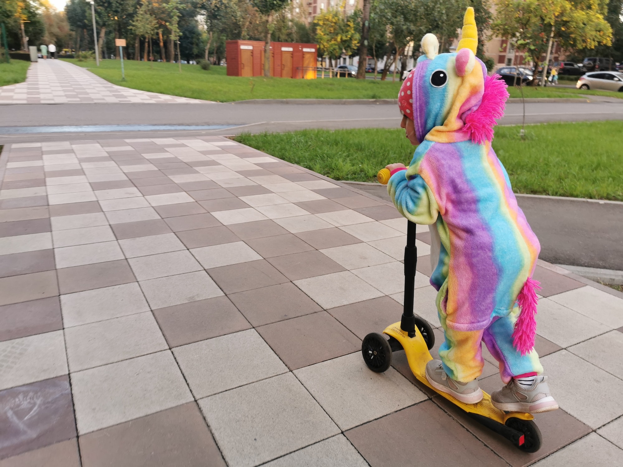 Little unicorn riding kick scooter