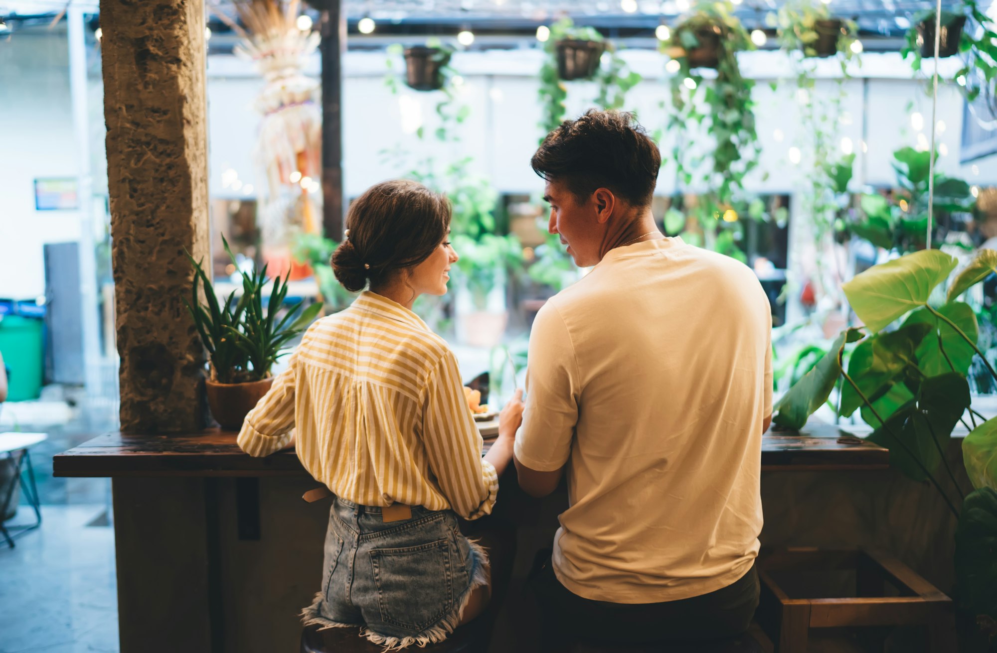 Young couple talking in modern cafe