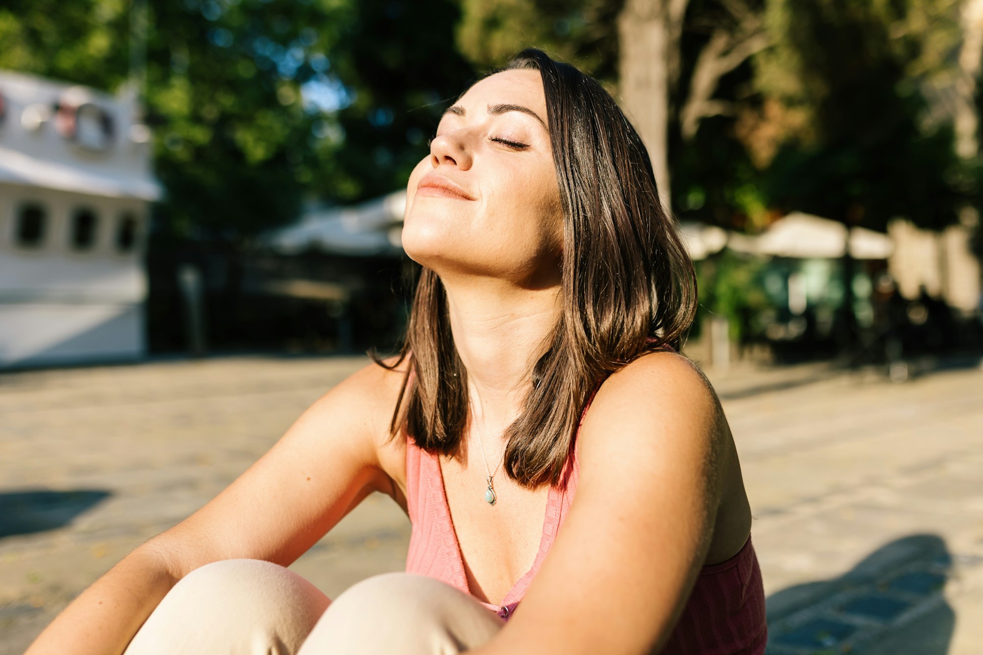 Young woman breathing deep fresh air